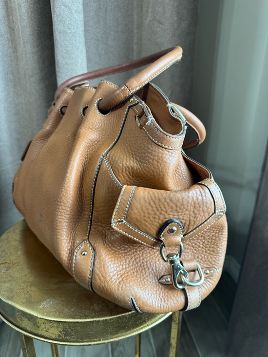 cole haan pebble leather backpack adjustable drawstring 11L x 6.9W x 11.8H 3.1 handle drop Adjustable backpack straps Cole Haan Men's Damon Backpack